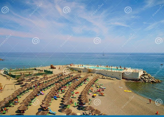Varazze tourist's port Varazze, Italy - People Relaxing and Sunbathing on the Beach Stock ... photo